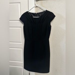Black formal dress. Size 8 petite. Cap sleeves and beautiful fabric detailing.